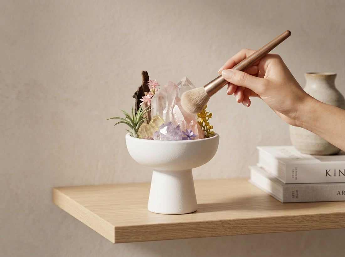 crystal care and cleansing — a crystal bonsai being gently dusted on a home shelf