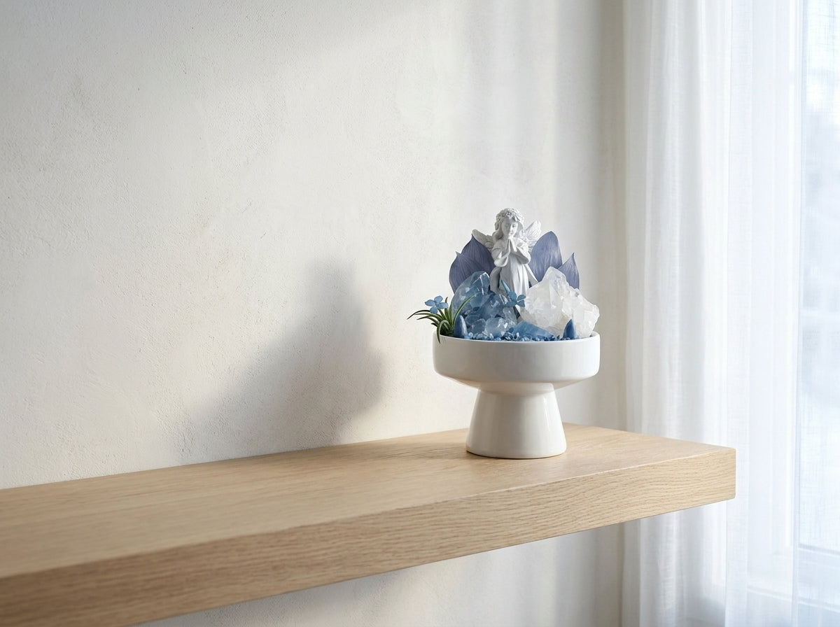 blue celestite crystal bonsai on a pale shelf by a winter window