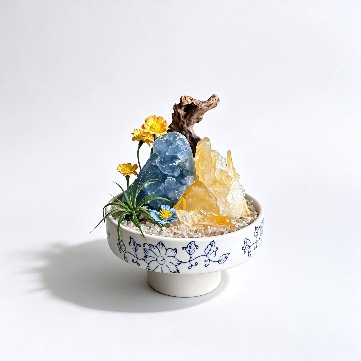 one-of-one crystal garden with black tourmaline, clear quartz, blue kyanite, air plant; front view on pure white background.