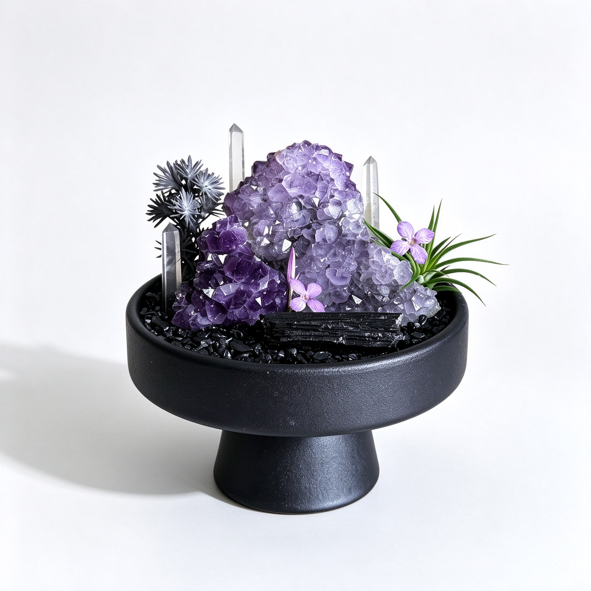 one-of-one crystal garden with grape amethyst mass, clear quartz pillars, black tourmaline, air plant; front view on pure white background.

