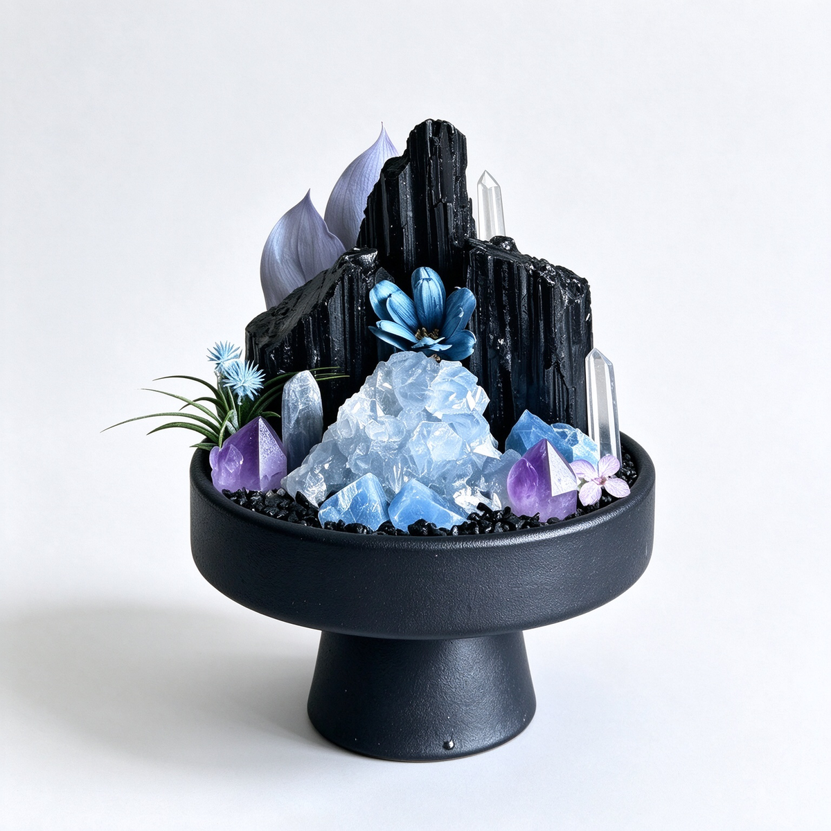 one-of-one crystal garden with black tourmaline, blue celestite, amethyst, blue kyanite, air plant; front view on pure white background.
