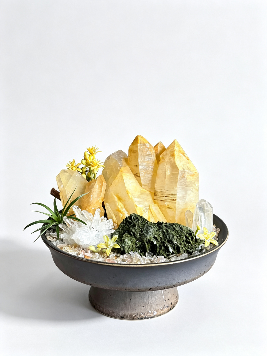 one-of-one crystal garden with golden healer quartz, clear quartz, green epidote, air plant; front view on pure white background.