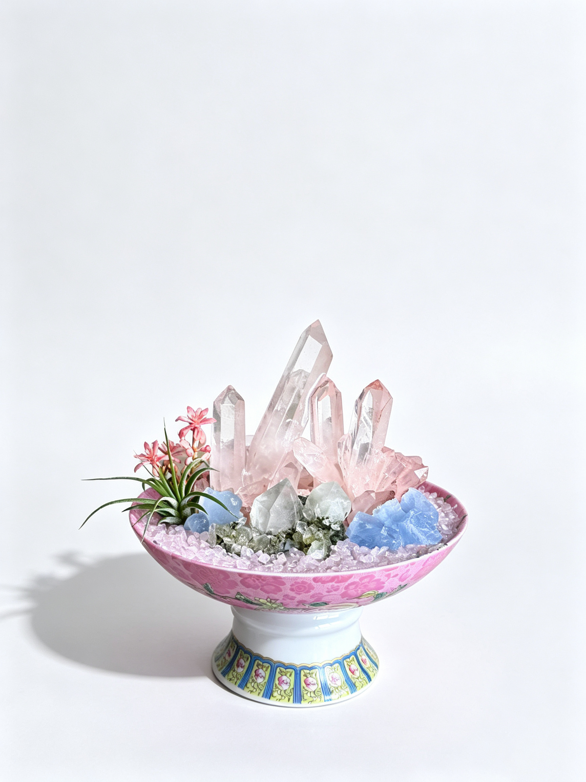 one-of-one crystal garden with rose quartz points, blue calcite, epidote, air plant; front view on pure white background.