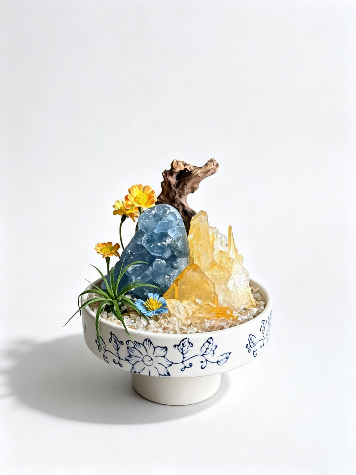 one-of-one crystal garden with black tourmaline, clear quartz, blue kyanite, air plant; front view on pure white background.