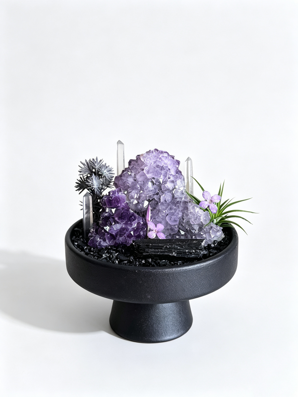 one-of-one crystal garden with grape amethyst mass, clear quartz pillars, black tourmaline, air plant; front view on pure white background.
