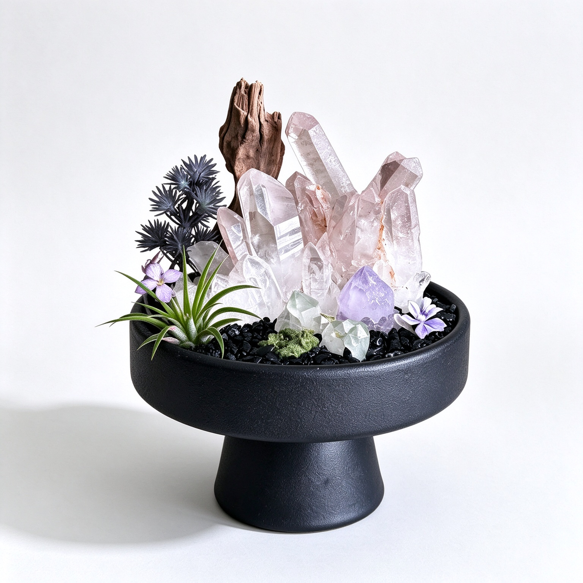  one-of-one crystal garden with smoky rose quartz, driftwood, amethyst, black tourmaline chips, air plant; front view on pure white background.

