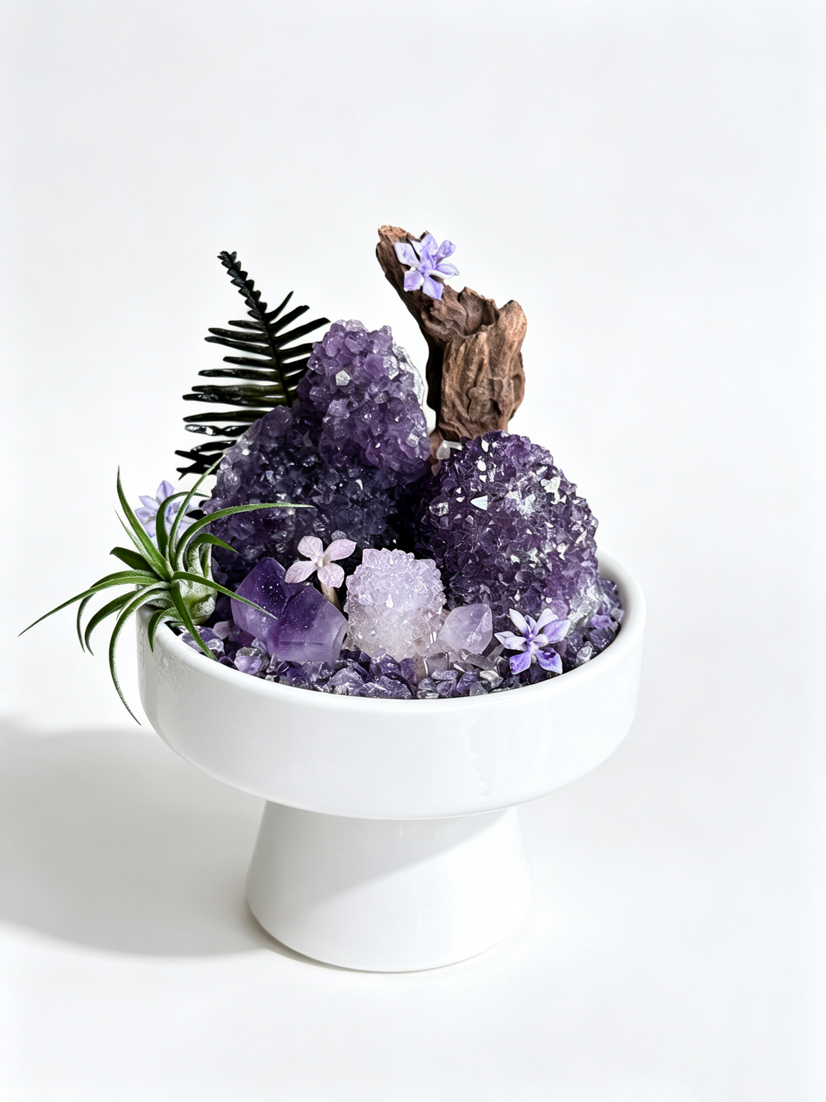 one-of-one crystal garden with twin amethyst clusters, pale amethyst, air plant; front view on pure white background.