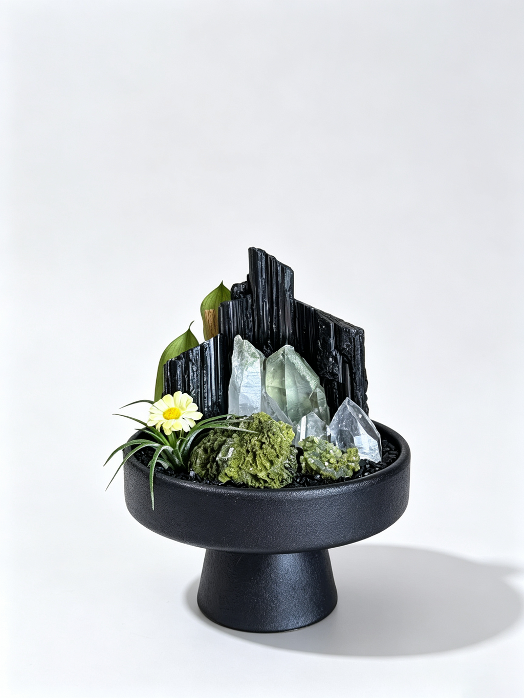 one-of-one crystal garden with black tourmaline, green phantom cluster, clear quartz point, air plant; front view on pure white background.

