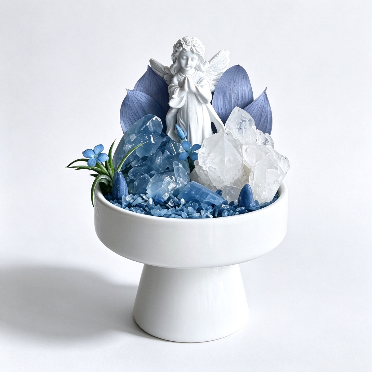 one-of-one crystal garden with porcelain angel, blue celestite, clear quartz, blue kyanite, air plant; front view on pure white background.
